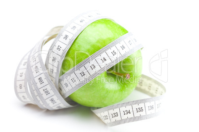 apple and measure tape isolated on white