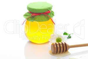 stick to hohey ,flower  and  jar of honey  isolated on white