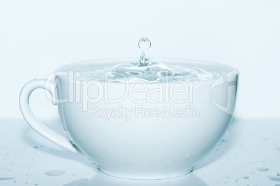 drop of water in a white cup