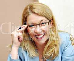 Businesswoman in glasses smiling