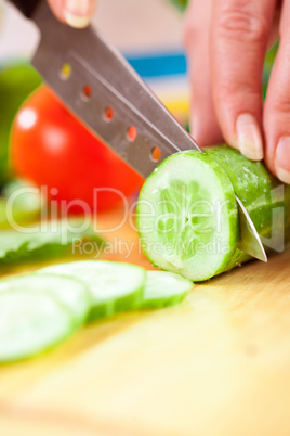 Woman's hands cutting vegetables