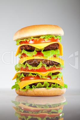 Tasty and appetizing hamburger on a grey