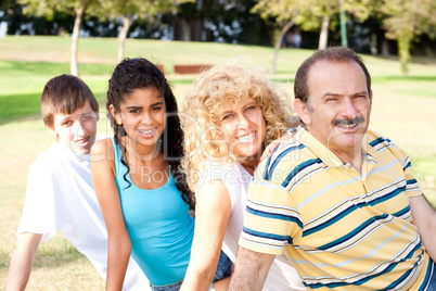 Portrait of family relaxing in park