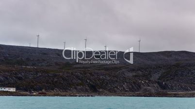wind generator on the mountain through the clouds, timelapse