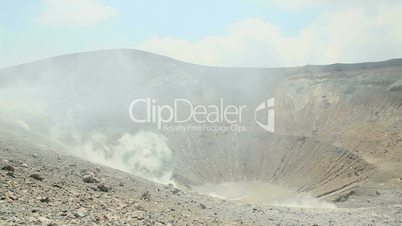 Volcano crater with smoke