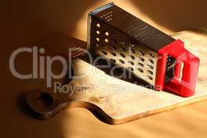 Grater On Cutting Board