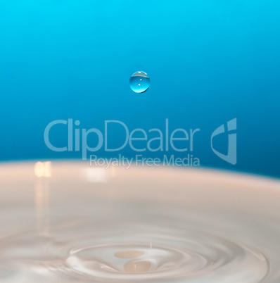 water drop and splash on a blue background