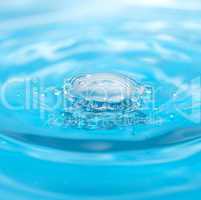 water drop and splash on a blue background