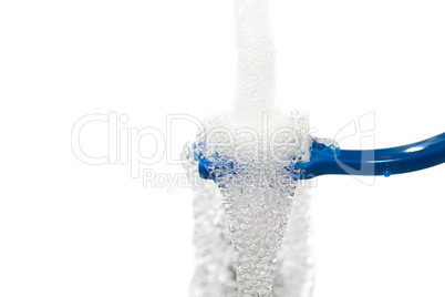 blue toothbrush under running water