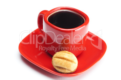 cup with coffee and cake nut isolated on white