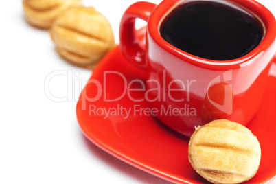 cup with coffee and cake nut isolated on white
