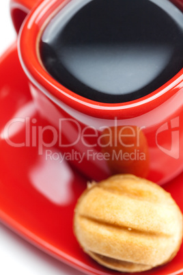 cup with coffee and cake nut isolated on white