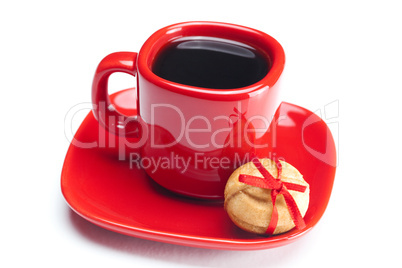 cup with coffee ,cake nut and ribbon isolated on white