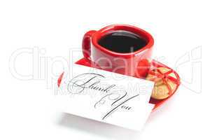 cup with coffee ,thank you card,cake nut and ribbon isolated on