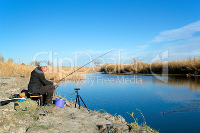 The fisherman is fishing on the river