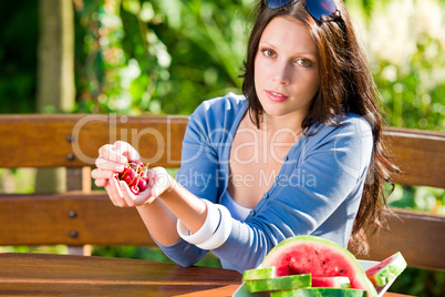 Fresh cherries melon woman garden summer terrace