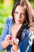 Fresh raspberries hold hand cheerful smiling woman