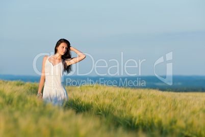 Sunset corn field beautiful brunette woman walk