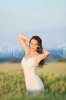 Sunset corn field beautiful brunette woman walk