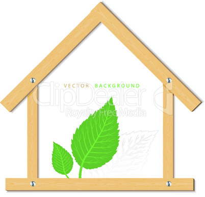 Wooden house and green leaves on white