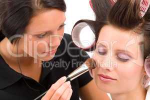 Make-up artist woman fashion model apply powder
