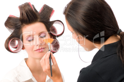 Make-up artist woman fashion model apply powder