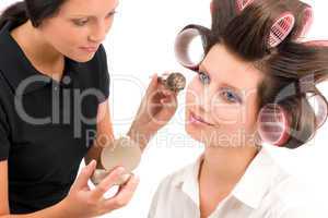 Make-up artist woman fashion model apply powder