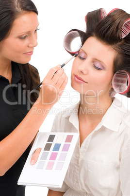 Make-up artist woman fashion model apply eyeshadow