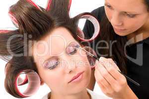 Make-up artist woman fashion model apply eyeshadow