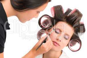 Make-up artist woman fashion model apply eyeshadow