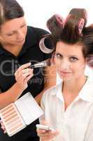 Make-up artist woman fashion model apply powder