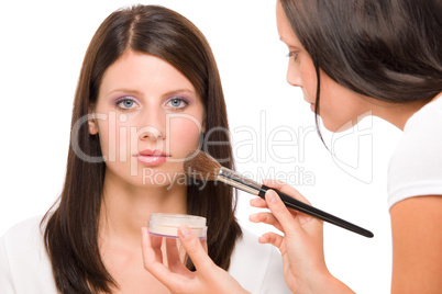 Make-up artist woman fashion model apply powder