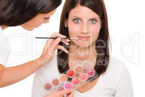 Make-up artist woman fashion model apply lipstick