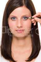 Facial portrait woman apply eye pencil lines