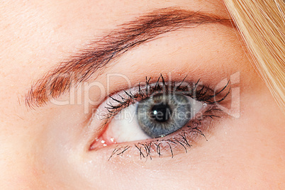 eye of beautiful young woman in studio