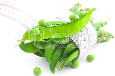 peas and measure tape isolated on white