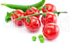 bunch of tomato and peas  isolated on white