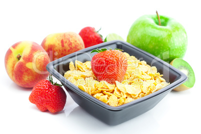 strawberry, peach, apple, kiwi and flakes in a bowl isolated on