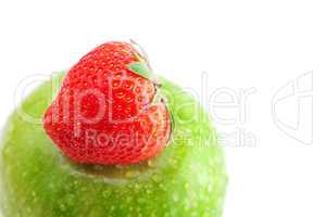 strawberries and apple with water drops tape isolated on white