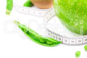 apple,lime,peas,kiwi and measure tape isolated on white