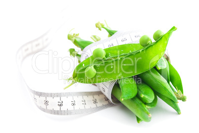 peas and measure tape isolated on white