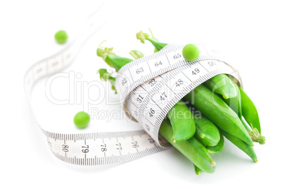 peas and measure tape isolated on white
