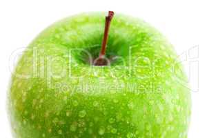 big green apple with water drops isolated on white