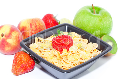 strawberry, peach, apple, kiw and flakes in a bowl isolated on w