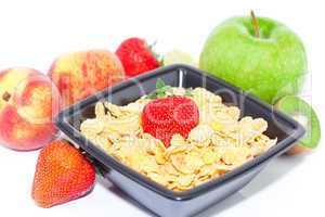 strawberry, peach, apple, kiw and flakes in a bowl isolated on w