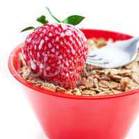 strawberry,milk,fork and wheat in a bowl isolated on white