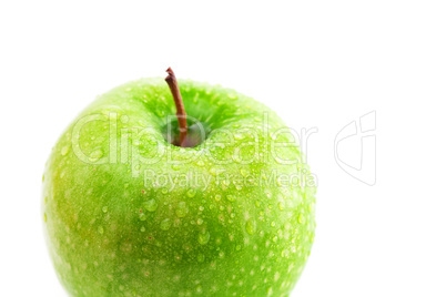 big green apple with water drops isolated on white