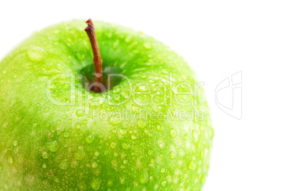 big green apple with water drops isolated on white