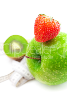 strawberries,apple with water drops,kiwi and measure tape isolat