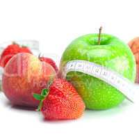big juicy red ripe strawberries,apple,peas,peach and measure tap